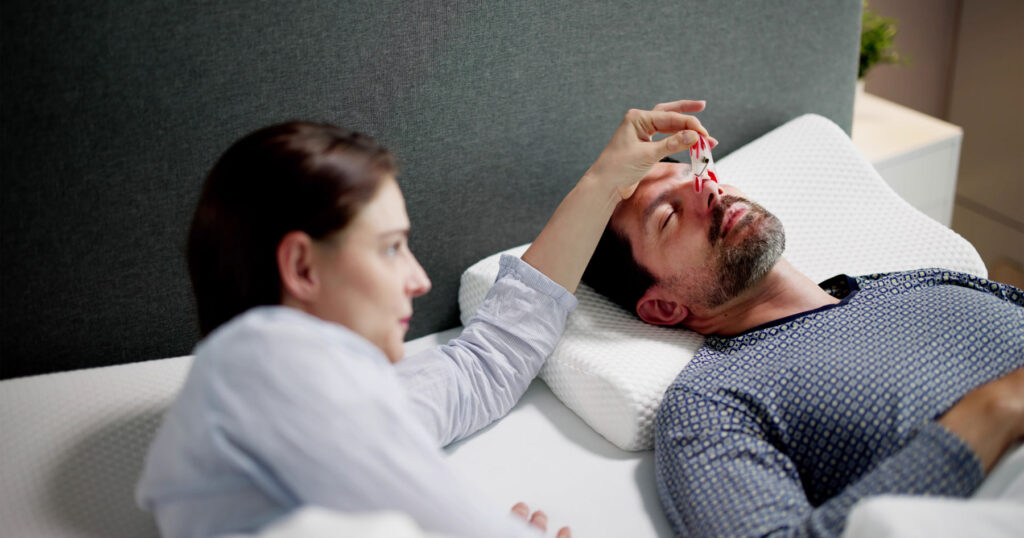 patient wearing sleep apnea and mandibular advancement