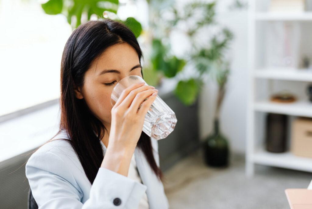 drinking water throughout the day to support oral health and hydration
