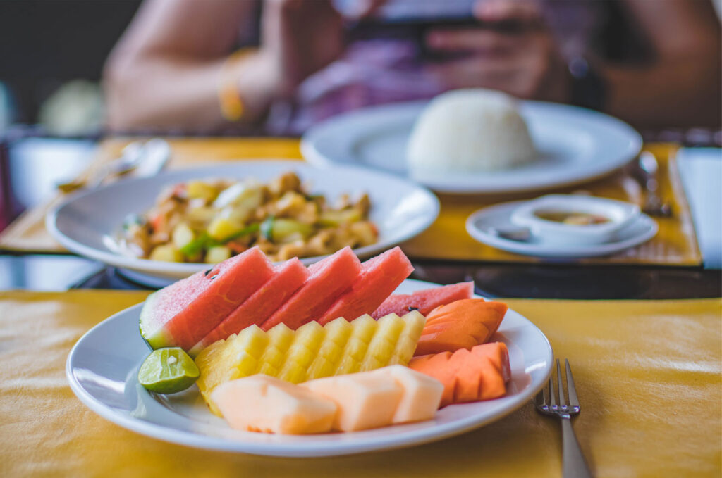 sliced apples and melon as braces friendly snacks