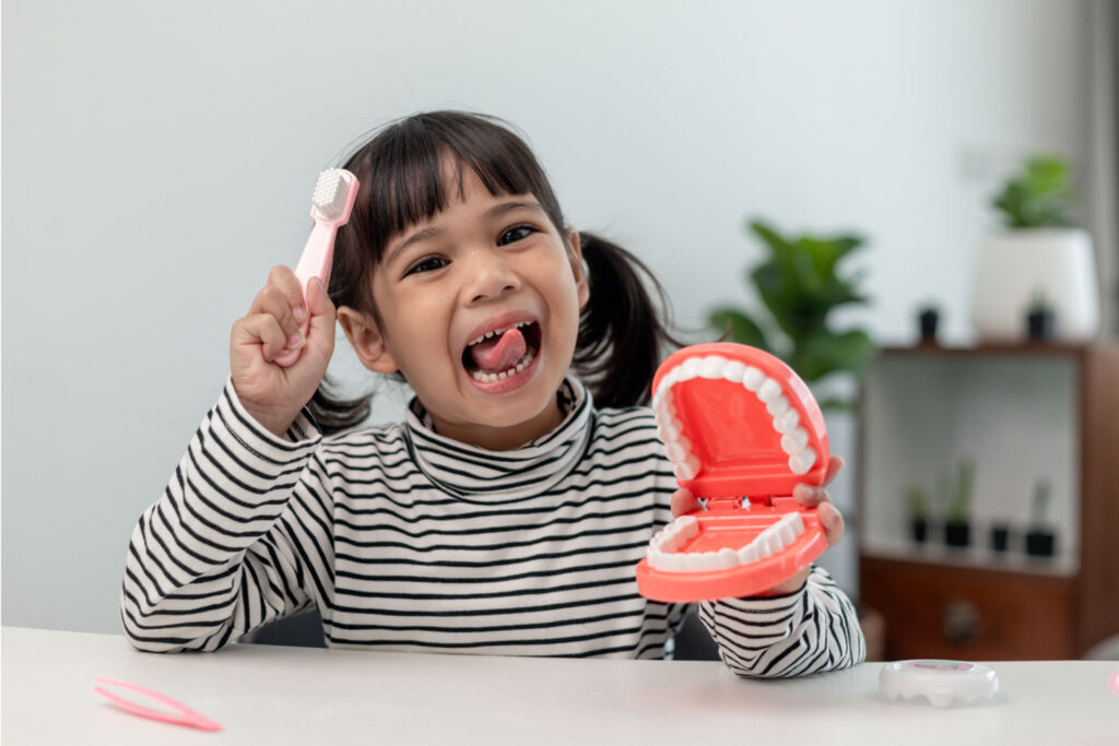 child holding comfort toy during dentist appointment to reduce anxiety