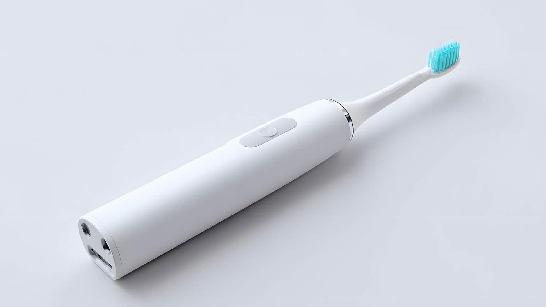 brushing too hard causing sensitive teeth at the gumline with toothbrush close-up
