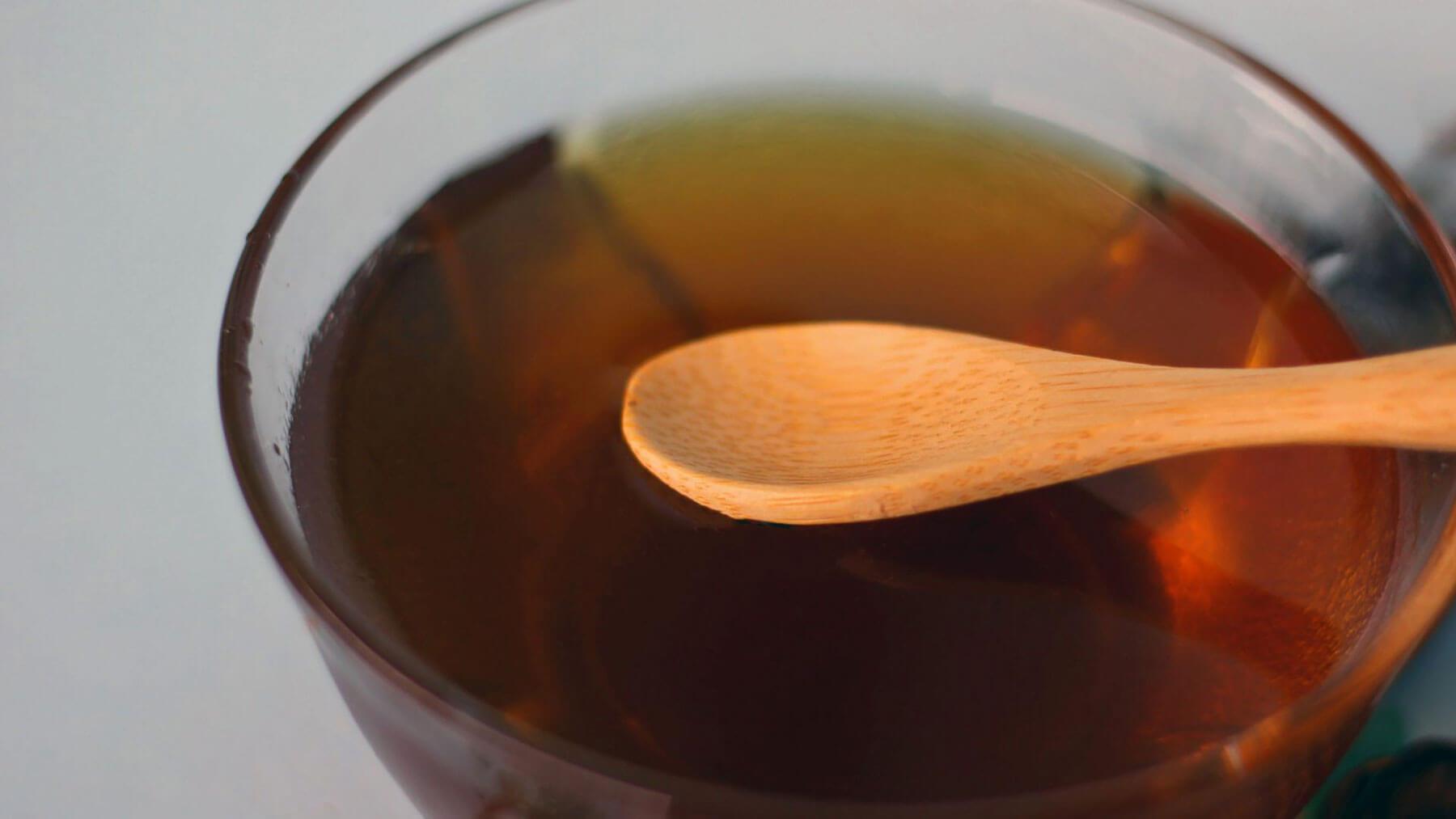 nk with spoon instead of straw during recovery, close-up of spoon