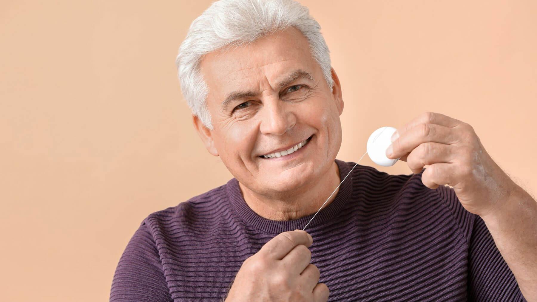 Floss-Daily-to-Preserve-Dental-Crowns