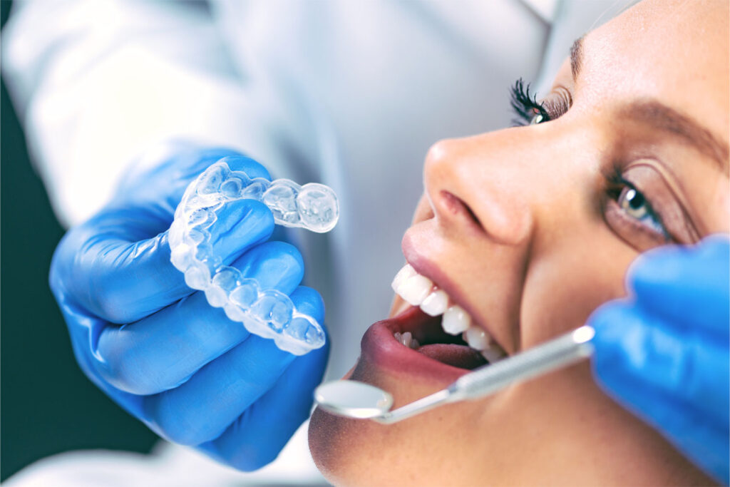dentist applying safe whitening treatment